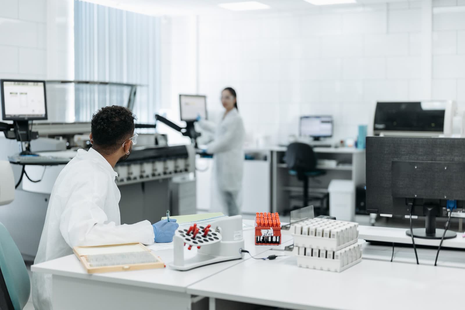 Technicians processing samples in an accredited clinical laboratory